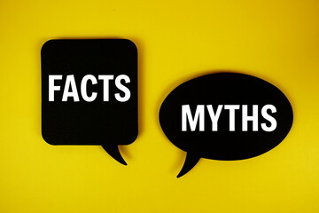 Facts vs Myths text on speech bubble top view on yellow background