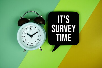 It's Survey Time text on speech bubble with alarm clock top view on green and yellow geometric...
