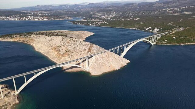Croatia, aerial view of Krk bridge which connects island Krk with the mainland. Traffic on the bridge