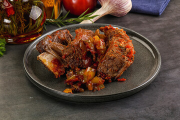 Baked beef ribs with vegetables
