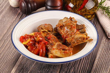 Baked lamb ribs with vegetables