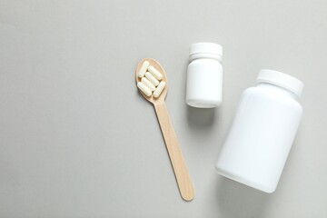 White bottles on color background 