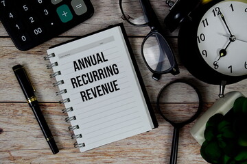 Annual Recurring Revenue (ARR) text on notepad, Business and Financial concept background