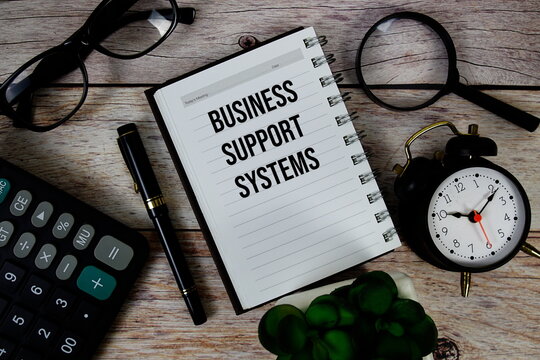 Business Support Systems (BSS) text on notepad, Business and Financial concept background