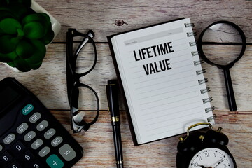 Lifetime Value (LTV) text on notepad, Business and Financial concept background