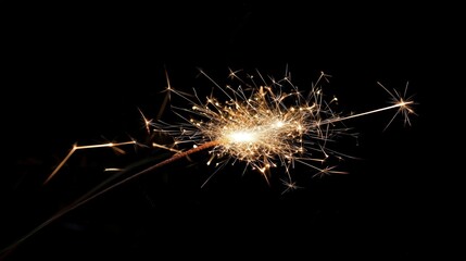Close-up of fireworks sparkling against a dark sky, festive and celebratory energy