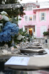 Elegant Garden Wedding with Blue and Pink Flowers. Charming Outdoor Wedding Venue with White Chiavari Chairs.