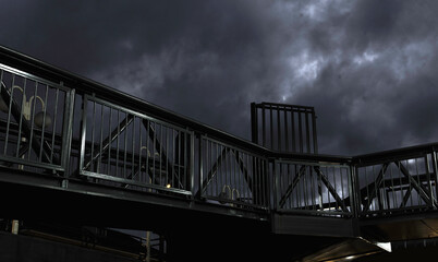 A bridge with a railing and a dark sky. The sky is overcast with storm clouds