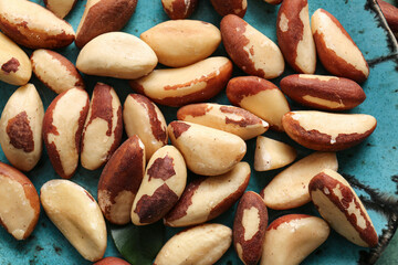 Plate with tasty Brazil nuts, closeup