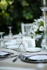 Outdoor Wedding Reception Setup with Elegant Tables and Floral Centerpieces