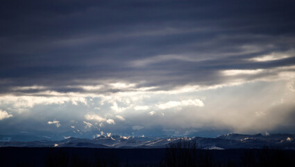 Clouds over the mountains. Dark clouds in the sky