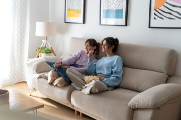 Two girls in a loving couple sharing a tender moment at home