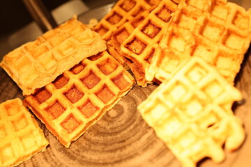 Indulge in these mouthwatering waffles stacked high, ideal for breakfast, delightful brunches, or even dessert