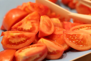 Vibrant red tomatoes, beautifully sliced and perfectly ready for salads, cooking, or various culinary dishes