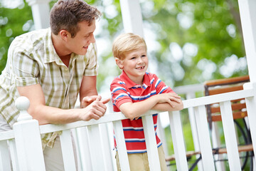 Fototapeta premium Love, patio or smile with father and son outdoor in garden of home for bonding, future or growth. Family, planning or vision with single parent man and boy child in backyard for conversation or trust