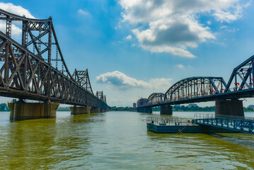 Obraz premium The steel bridge connecting the Yalu River in China to North Korea