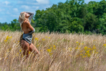 Spring Radiance: Blonde Beauty Embraces Nature in Lingerie Amid Blooming Fields