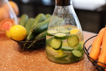 Crisp and refreshing cucumber slices steeped in infused lemon water make for a deliciously healthy drink option