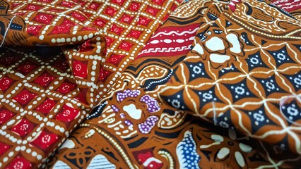 Fototapeta premium Batik Tulis Jogja, Batik tulis of Yogyakarta in Indonesia. This Batik illustrates the beauty of traditional fine art with distinctive patterns and motifs. Contains deep cultural and historical values.