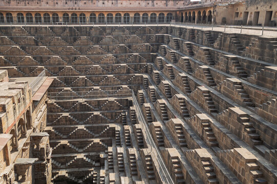 Public Chand Baori ancient deepest and largest stepwells of India in the village Abhaneri , Jaipur, Rajasthan ,India.
