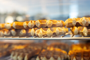 Freshly baked waffles on a metal grill