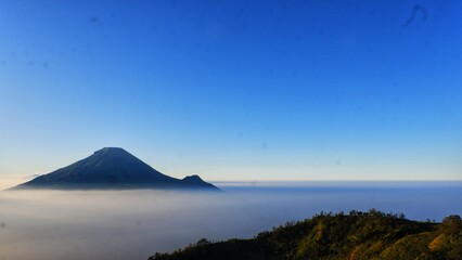 Dieng plateau. View of Dieng plateau in sunrise moment and in bluesky. The highest plateau island in Java, Indonesia.
