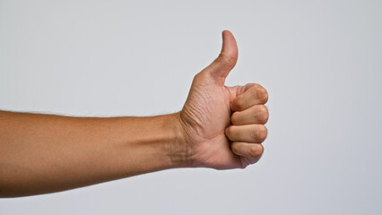 Man's hand giving a thumbs up against a plain white background, highlighting a positive gesture and...