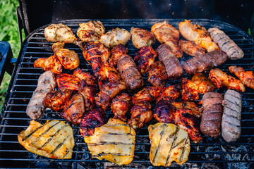 grilled meat over the coals on barbecue