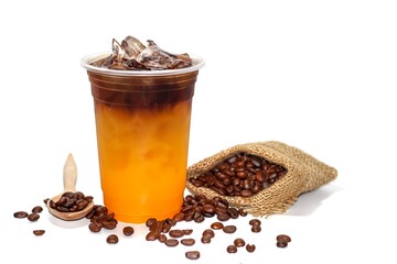 Americano ice coffee with orange juice and coffee beans spread out of sack put on white background