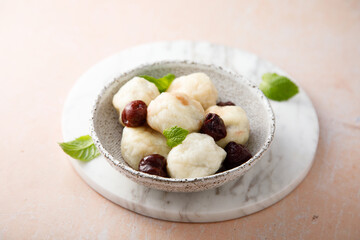 Homemade cottage cheese dumplings with cherry