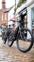 Fototapeta premium Electric mountain bikes elegantly lined up beside a shop on a sunny day, highlighting an outdoor cycling adventure