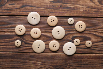 Wooden buttons on a wooden background
