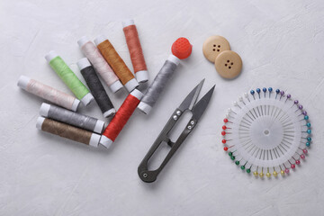 Tailor sewing accessories on concrete background