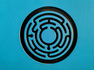 Black and blue Circular round Maze labyrinth  on Vibrant Blue Background. challenge and problem solving concept. find your path. Flat lay, top view