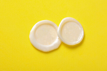 Mockup of white wax seals on yellow background