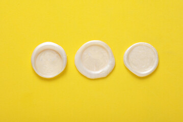 Mockup of white wax seals on yellow background