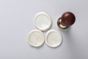 Vintage personal stamp and wax seals on gray background