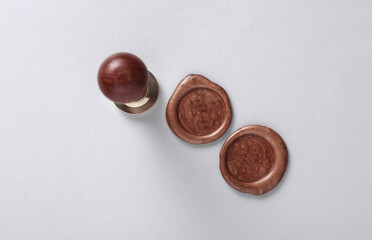 Vintage personal stamp and wax seals on gray background