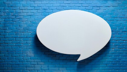 Empty white speech bubble on the miniature blue brick wall