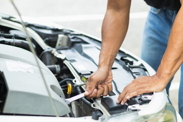 car service center mechanics are checking condition car and engine make sure they are ready use and in perfect condition according center warranty. periodic vehicle inspections for safety in driving.