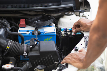 car service center mechanics are checking condition car and engine make sure they are ready use and in perfect condition according center warranty. periodic vehicle inspections for safety in driving.