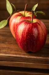 red apple on wooden table