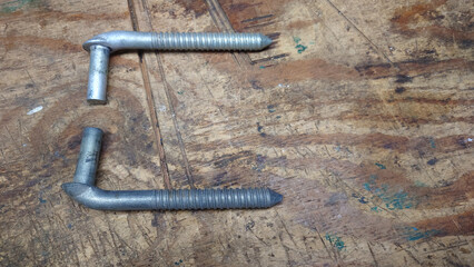 two galvanized steel flat-panel farm gate hinge bolts for screwing into wooden gate posts