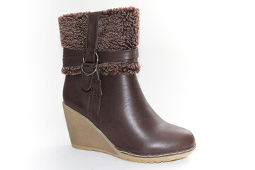 Women's Winter Boots and Shoes. On a white background. Side view. Unbranded model.