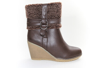 Women's Winter Boots and Shoes. On a white background. Side view. Unbranded model.