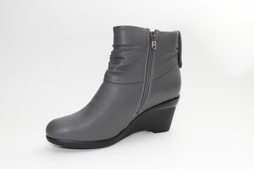 Women's Winter Boots and Shoes. On a white background. Side view. Unbranded model.