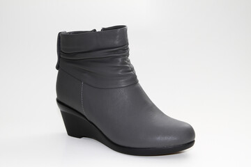 Women's Winter Boots and Shoes. On a white background. Side view. Unbranded model.