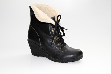 Women's Winter Boots and Shoes. On a white background. Side view. Unbranded model.