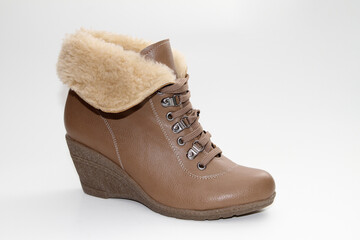 Women's Winter Boots and Shoes. On a white background. Side view. Unbranded model.