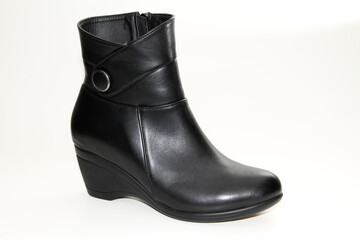 Women's Winter Boots and Shoes. On a white background. Side view. Unbranded model.